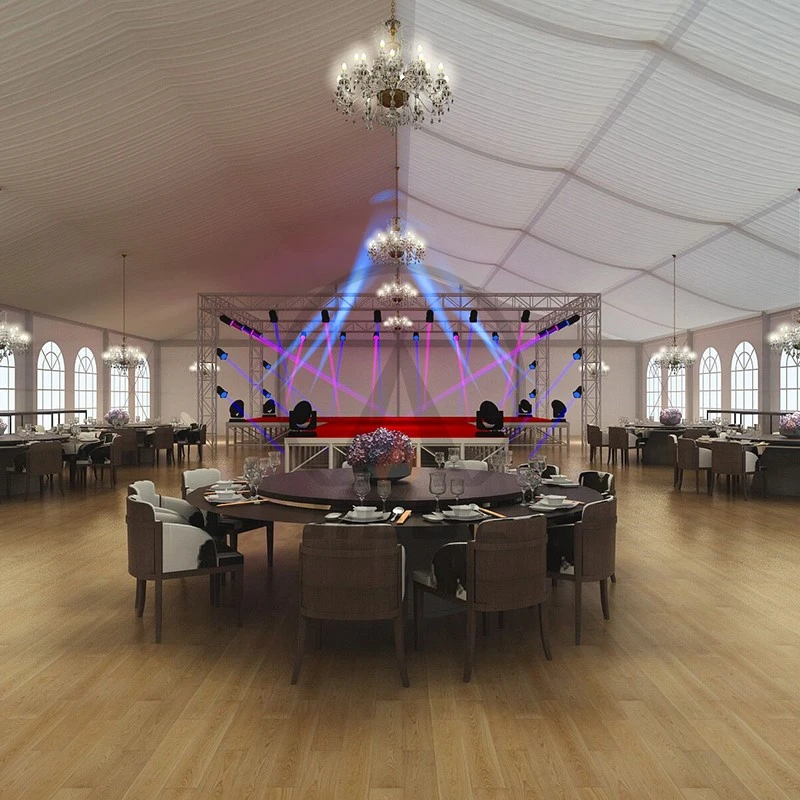 Elegantly decorated banquet hall with stage and chandeliers. Elegantly decorated banquet hall with stage and chandeliers.